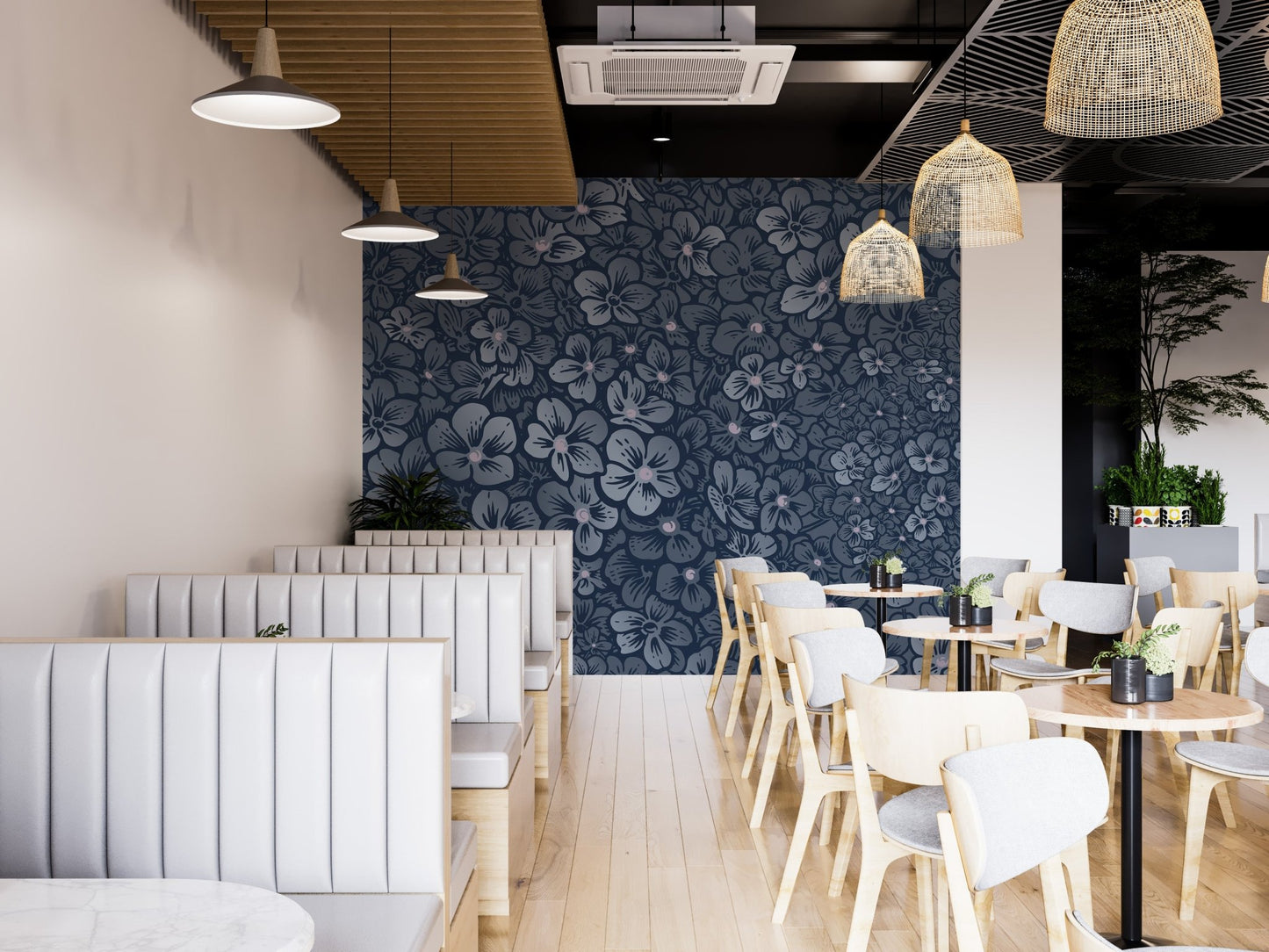 Floral wall mural in a cafe dining area with white booths and wooden tables.