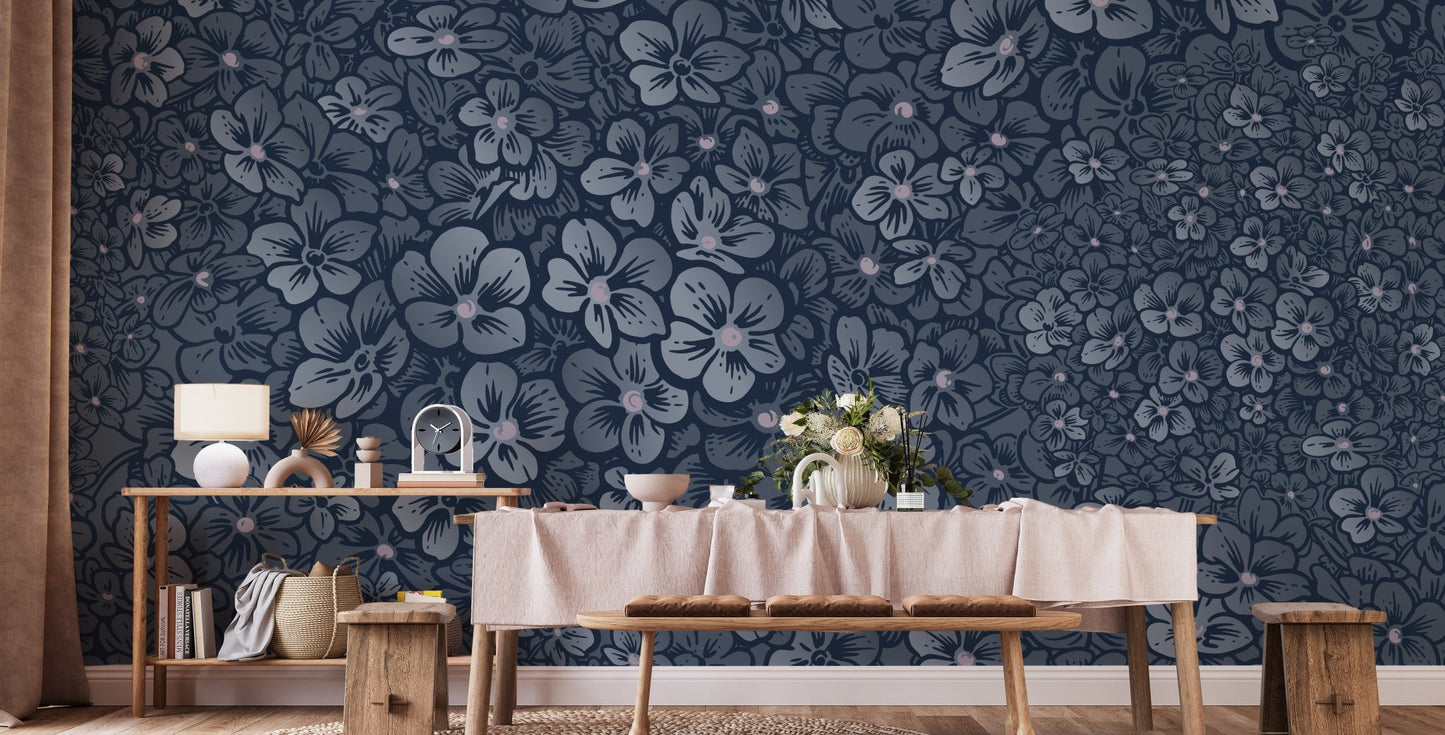 Blue floral wall mural in a dining room with a long wooden table and bench.