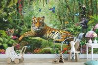 Tropical green safari wall mural with a tiger and white toy pram in a nursery.