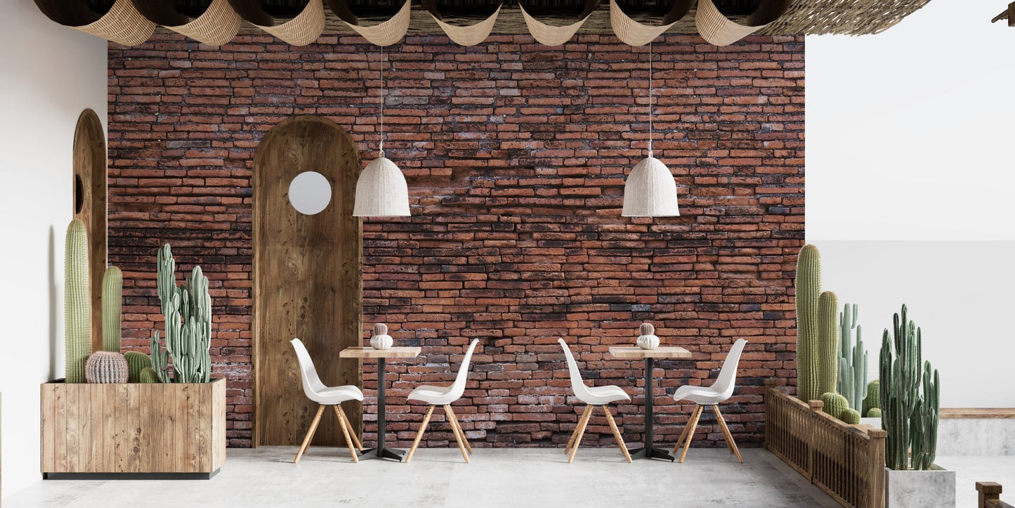 Rustic brickwork wall mural used as a backdrop for a minimalist cafe dining area.