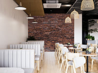 Realistic brick pattern wallpaper mural in a spacious restaurant with wooden tables.