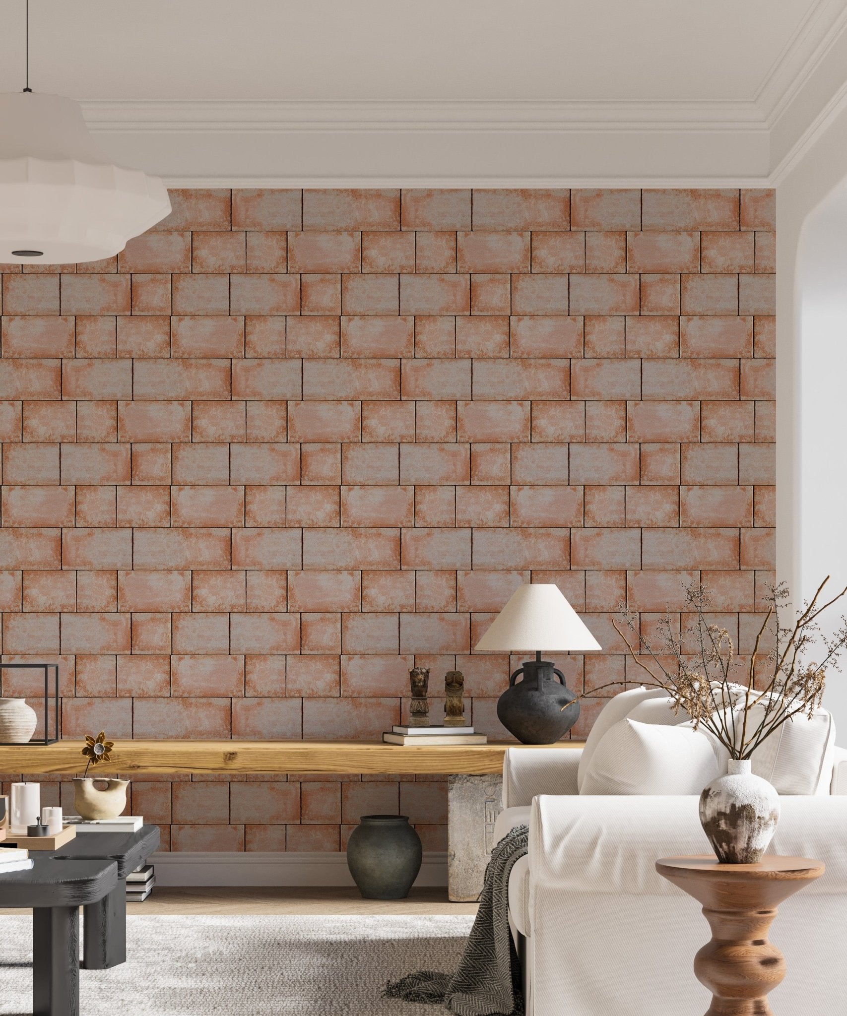 Sandstone blocks wallpaper in a living area with grey sofa and cushions.