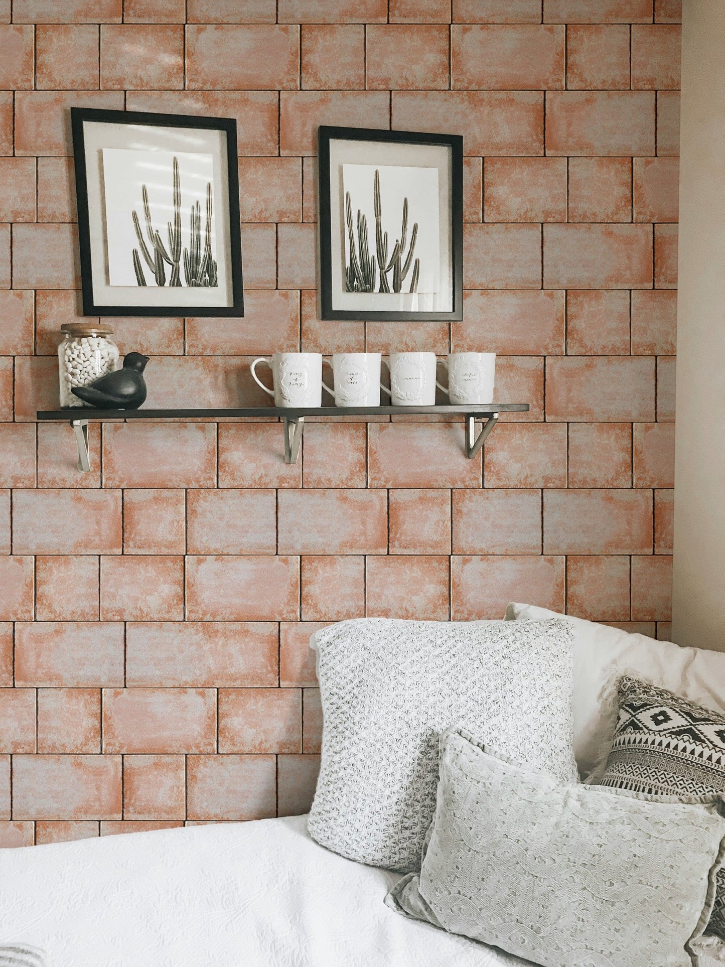 Sandstone blocks wallpaper in a light filled studio apartment.