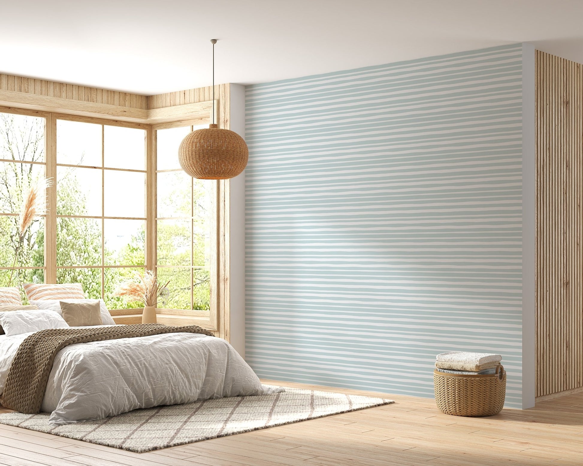 Bright bedroom with sea green horizontal striped wallpaper and natural lighting.