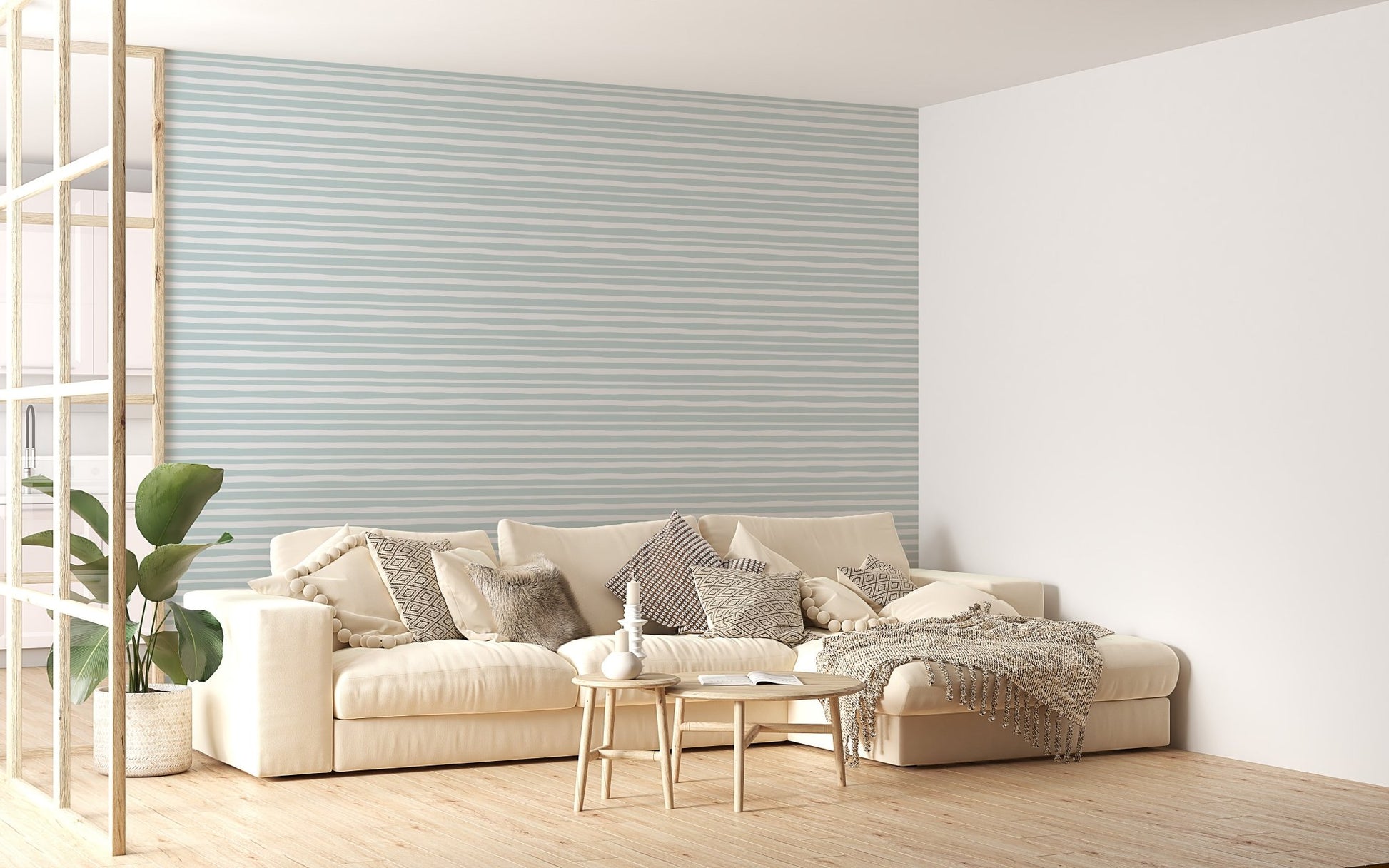 Minimalist living room featuring light green striped wallpaper behind a white sofa.