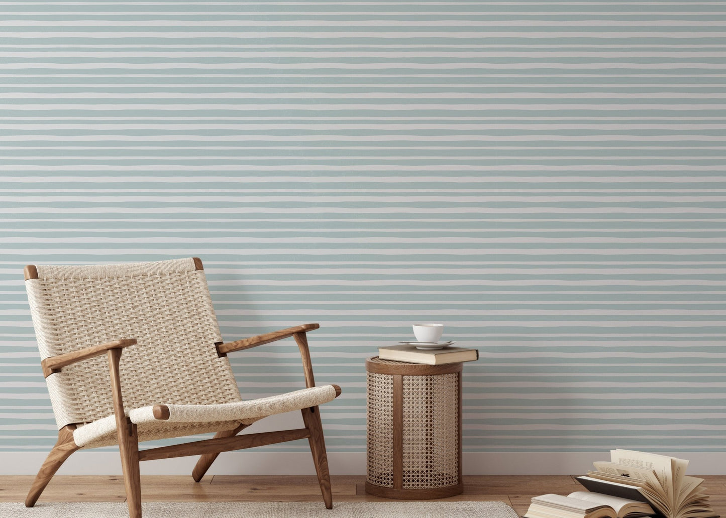 Modern living area with a wooden chair and sea green striped wallpaper.