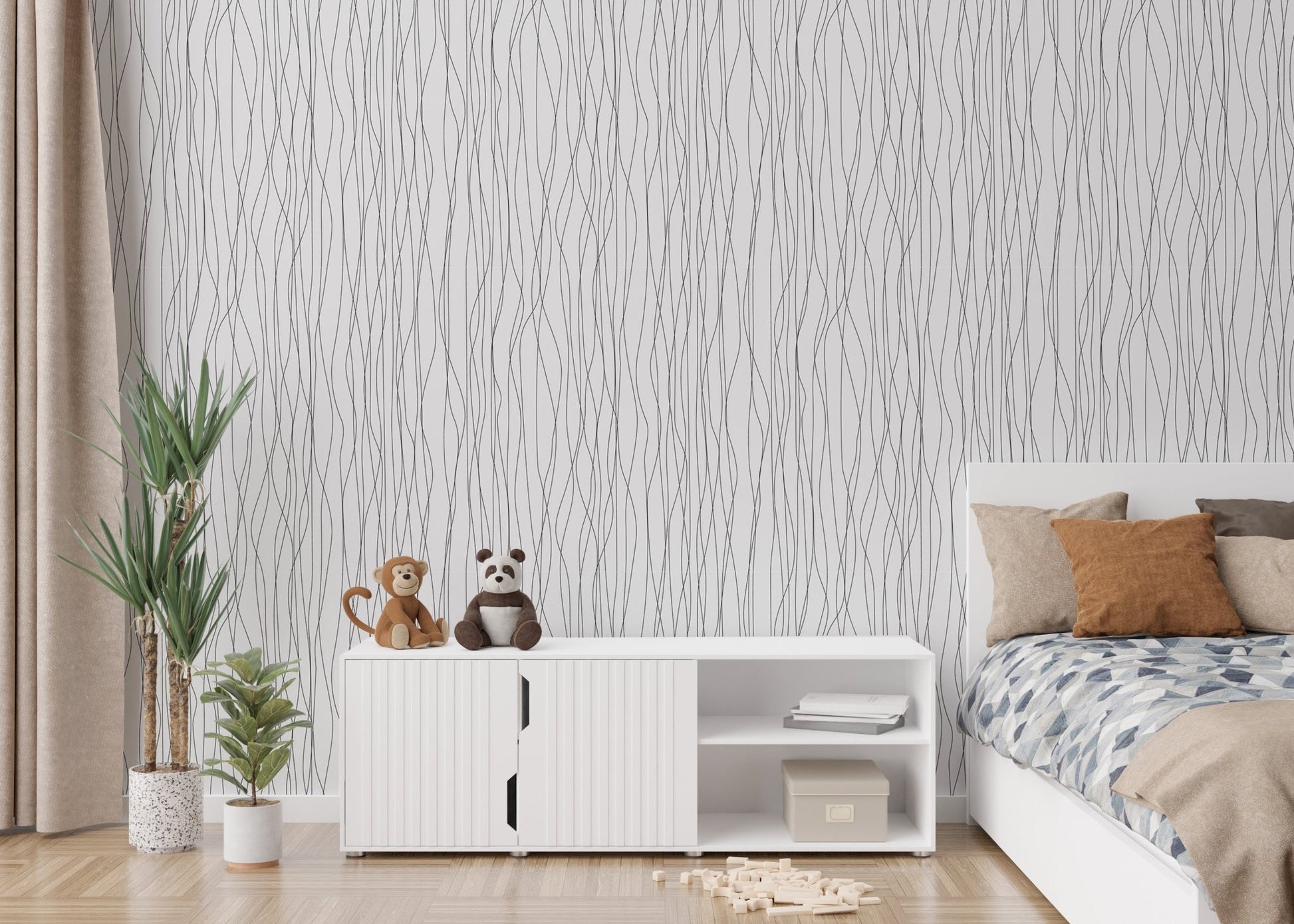 Low platform bed backed by a delicate striped pattern wallpaper