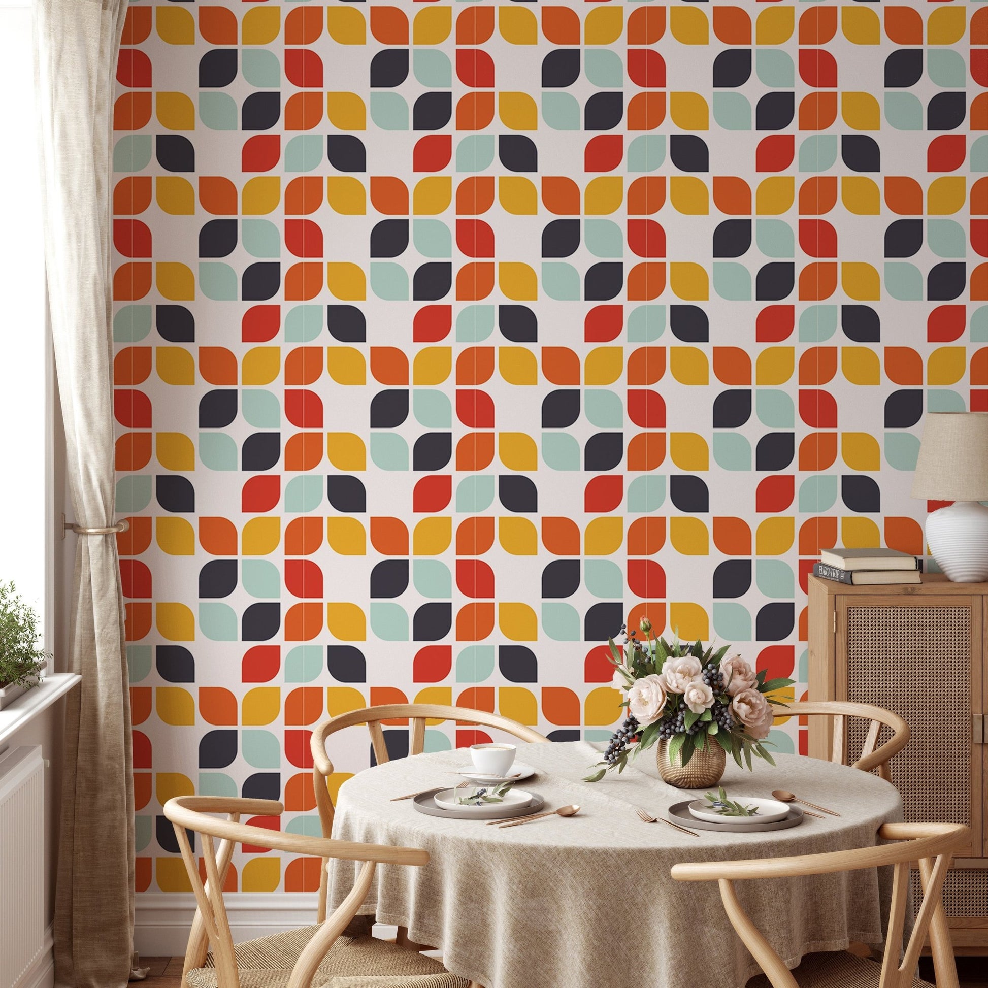 Mid-century vintage tile pattern wall mural in a dining area with a round table and chairs.
