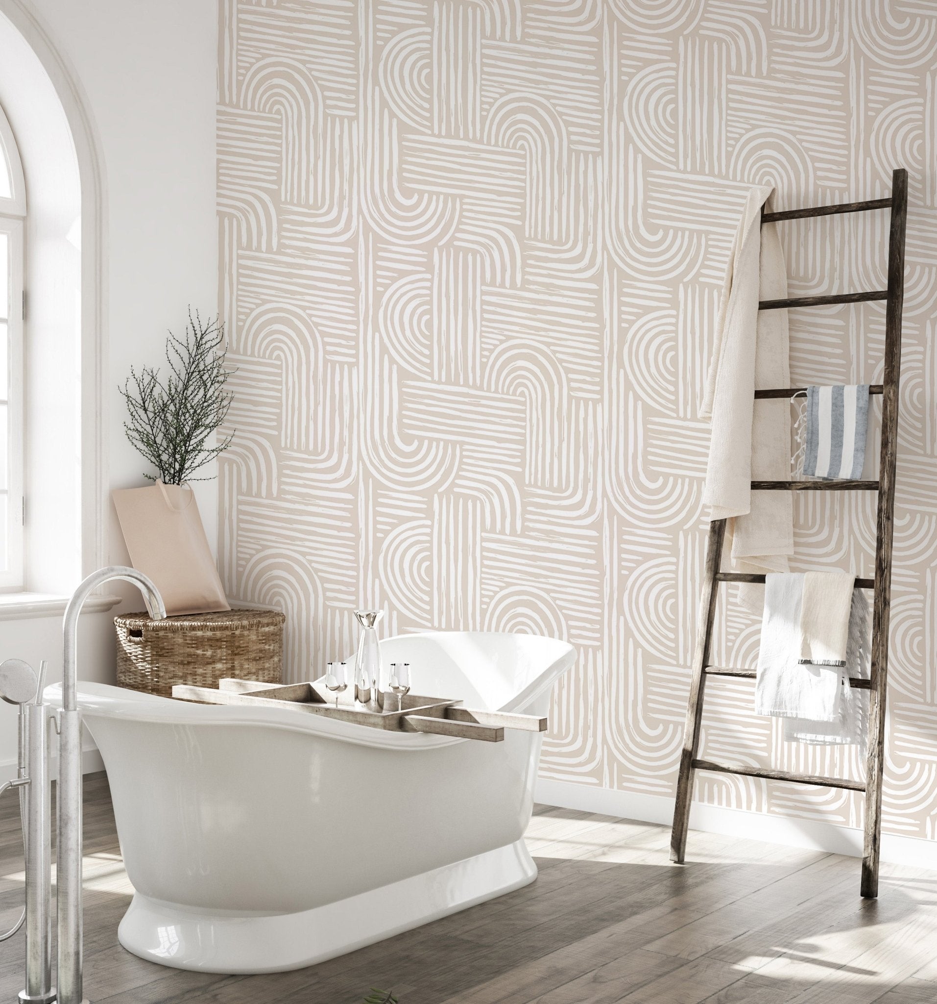 Bathroom wallpaper featuring line art patterns behind a white freestanding tub.