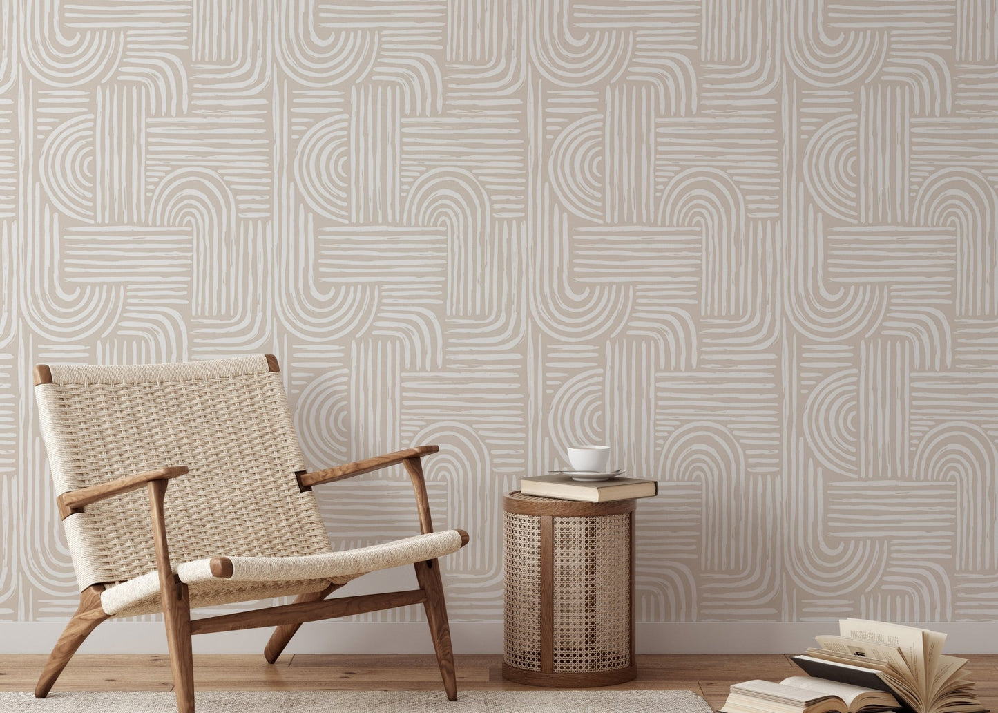 Abstract line wallpaper in a living room with a woven lounge chair and wooden side table.
