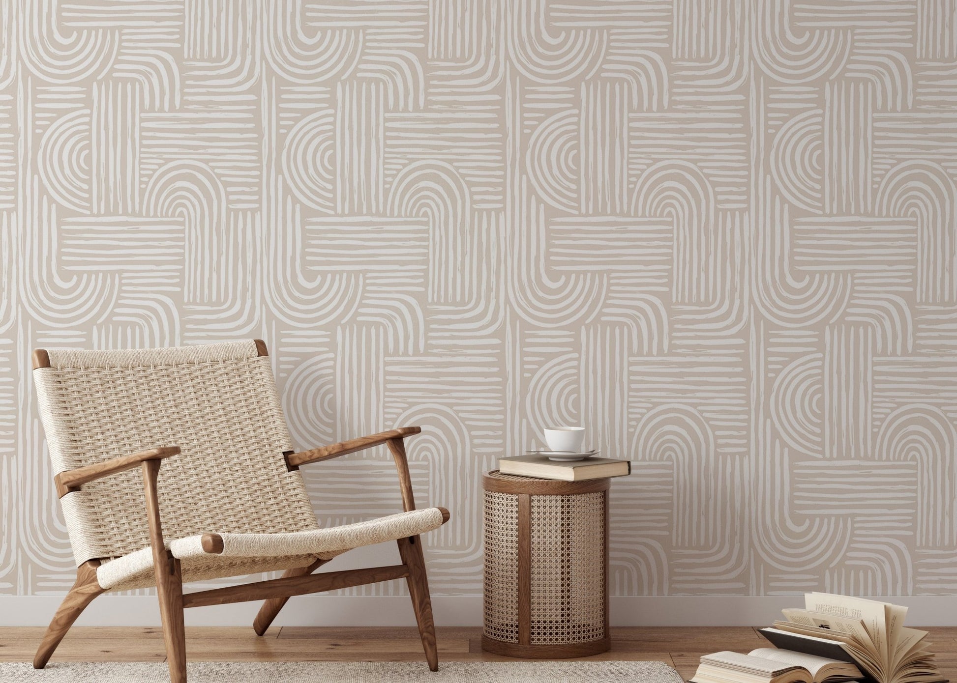 Abstract line wallpaper in a living room with a woven lounge chair and wooden side table.