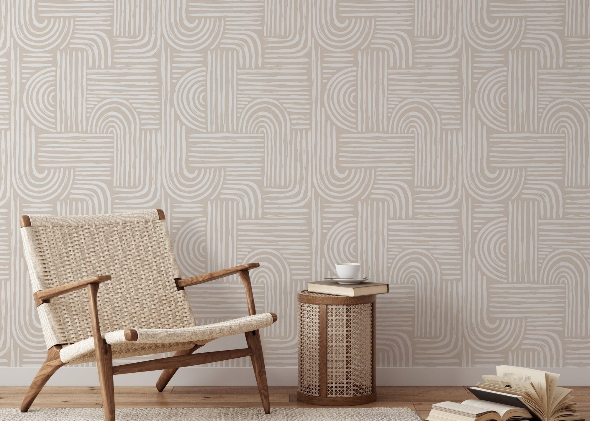 Abstract line wallpaper in a living room with a woven lounge chair and wooden side table.