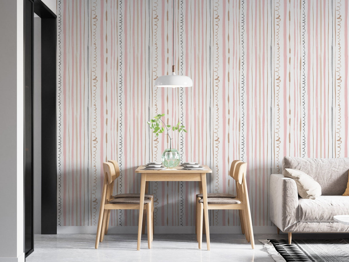 Modern dining space featuring pink striped wallpaper and wooden chairs.