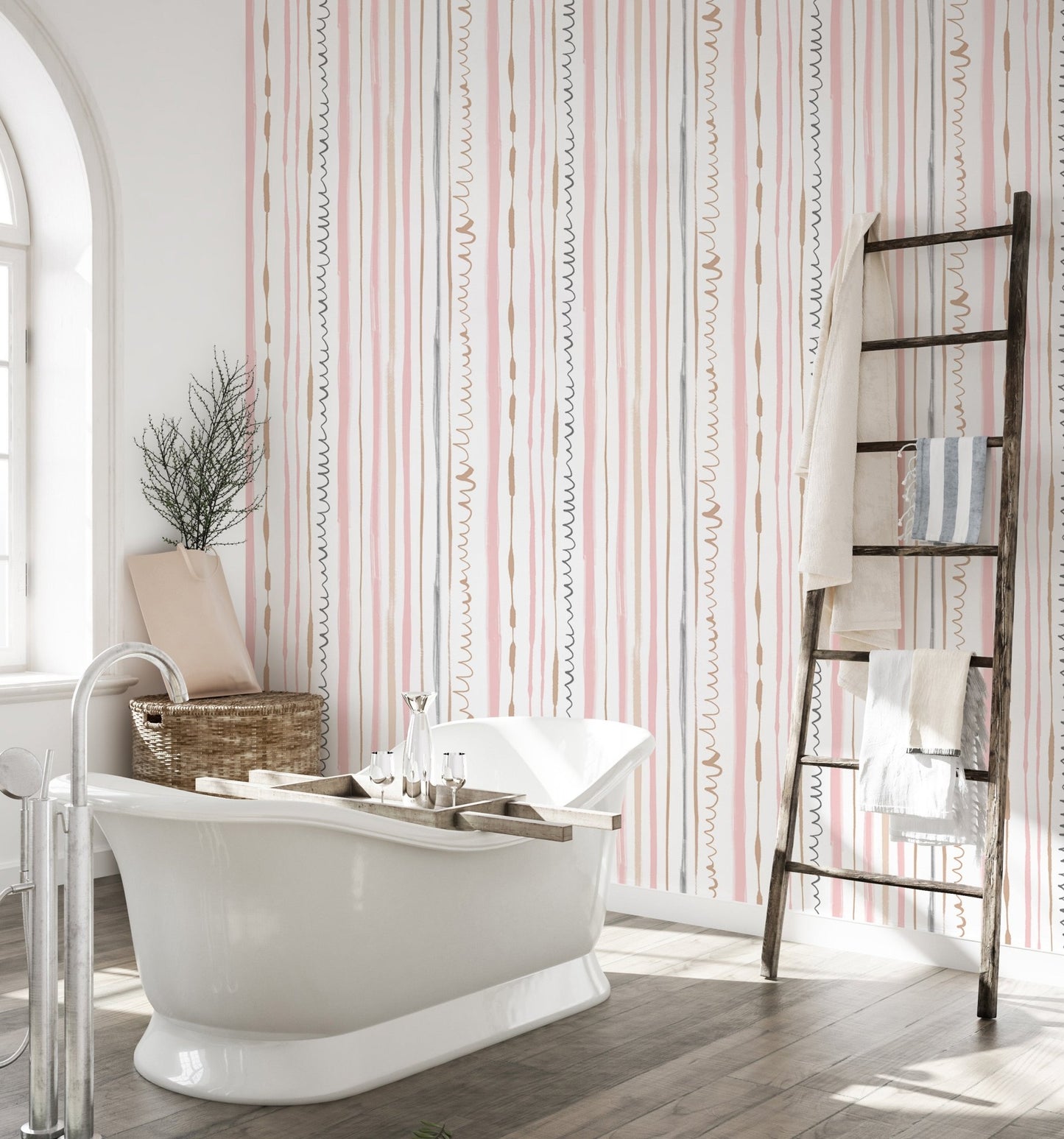 Bathroom featuring pink striped wallpaper behind a white bathtub and wooden ladder.