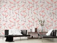 Modern hallway wall covered in pink flamingo pattern wallpaper with black bench.
