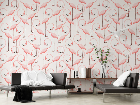 Modern hallway wall covered in pink flamingo pattern wallpaper with black bench.