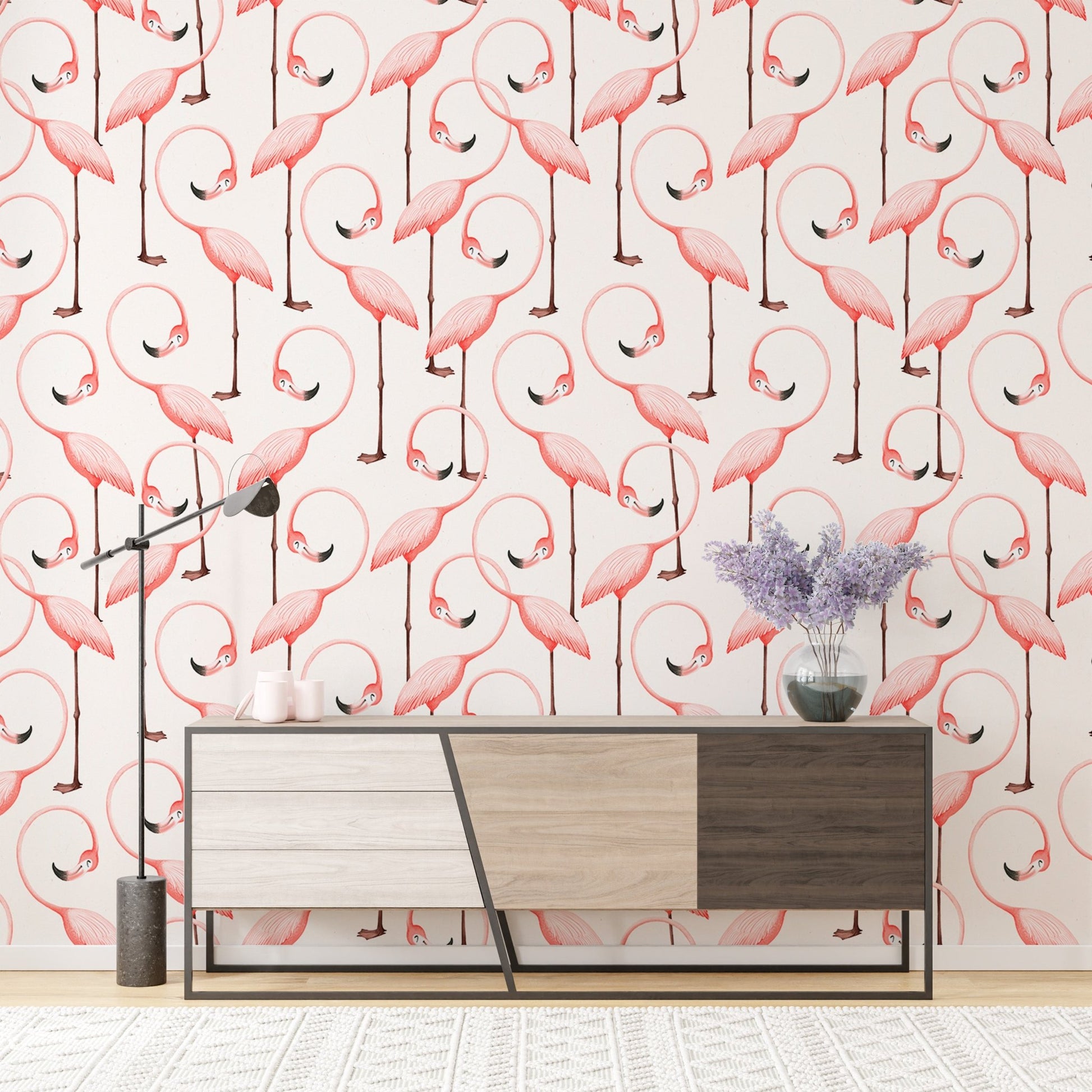 Pink flamingo wallpaper on living room wall behind a modern wooden sideboard.