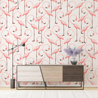 Pink flamingo wallpaper on living room wall behind a modern wooden sideboard.