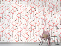 Stylish self-adhesive wallpaper with pink flamingo motif in kids room.