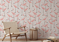 Elegant wallpaper with pink flamingos in a repeat design in reading room.