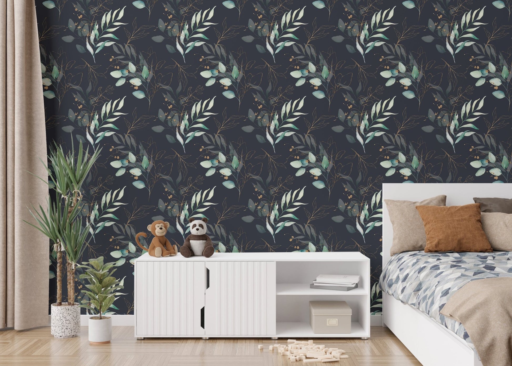 Green leaves wallpaper in a bright room with white cabinets and a potted plant.