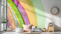 Pastel watercolor strokes wall mural for playroom featuring stuffed animals and shelves.