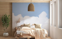 Artistic azure sky mural with clouds for tranquil bedroom ambiance.
