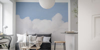 Azure sky wall mural featuring delicate white clouds in small living area.
