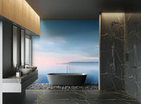 Minimalist calm water wallpaper with bright sun glow and blue sea.