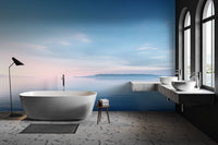 Serene bay calm water wallpaper with clear sky and distant tree line.