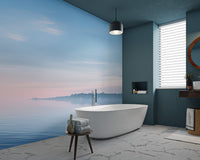 Serene bay calm water wallpaper featuring a blue horizon and soft light.
