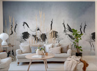 Artistic crane bird wall mural in a contemporary living room with white furniture.