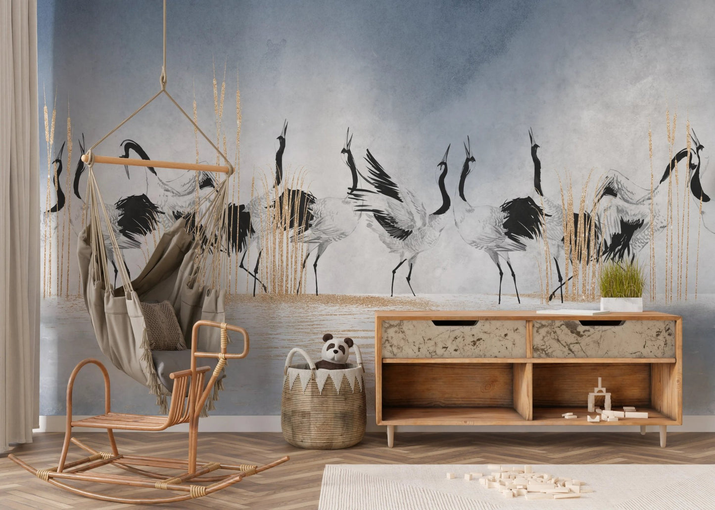 Abstract crane bird wall mural in a room with a wicker chair and wooden console.
