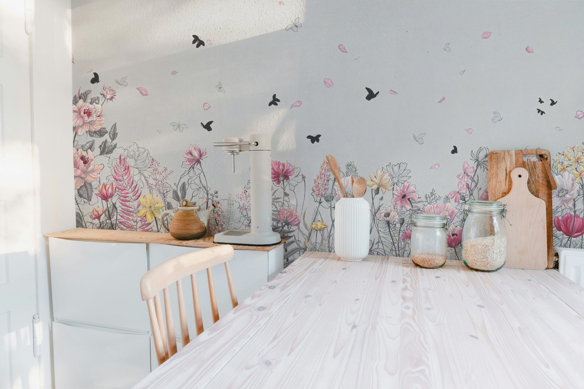 Kitchen wall mural featuring pink floral and black butterflies above cabinets