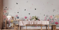 Long dining table set against a wall mural with meadow floral and butterflies