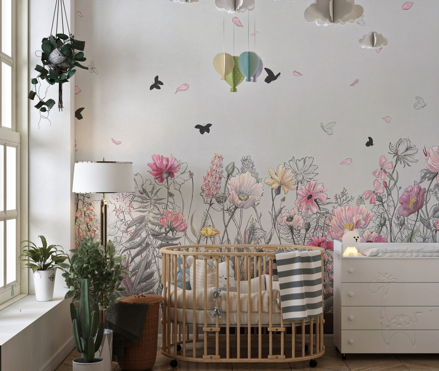 Nursery wall mural with floral sketches and butterfly patterns.