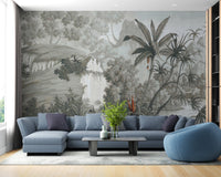 Grey botanical wallcoverings murals in a living space with a blue sectional.