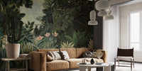 Botanical forest wall mural in a living area with a leather couch and indoor plants.