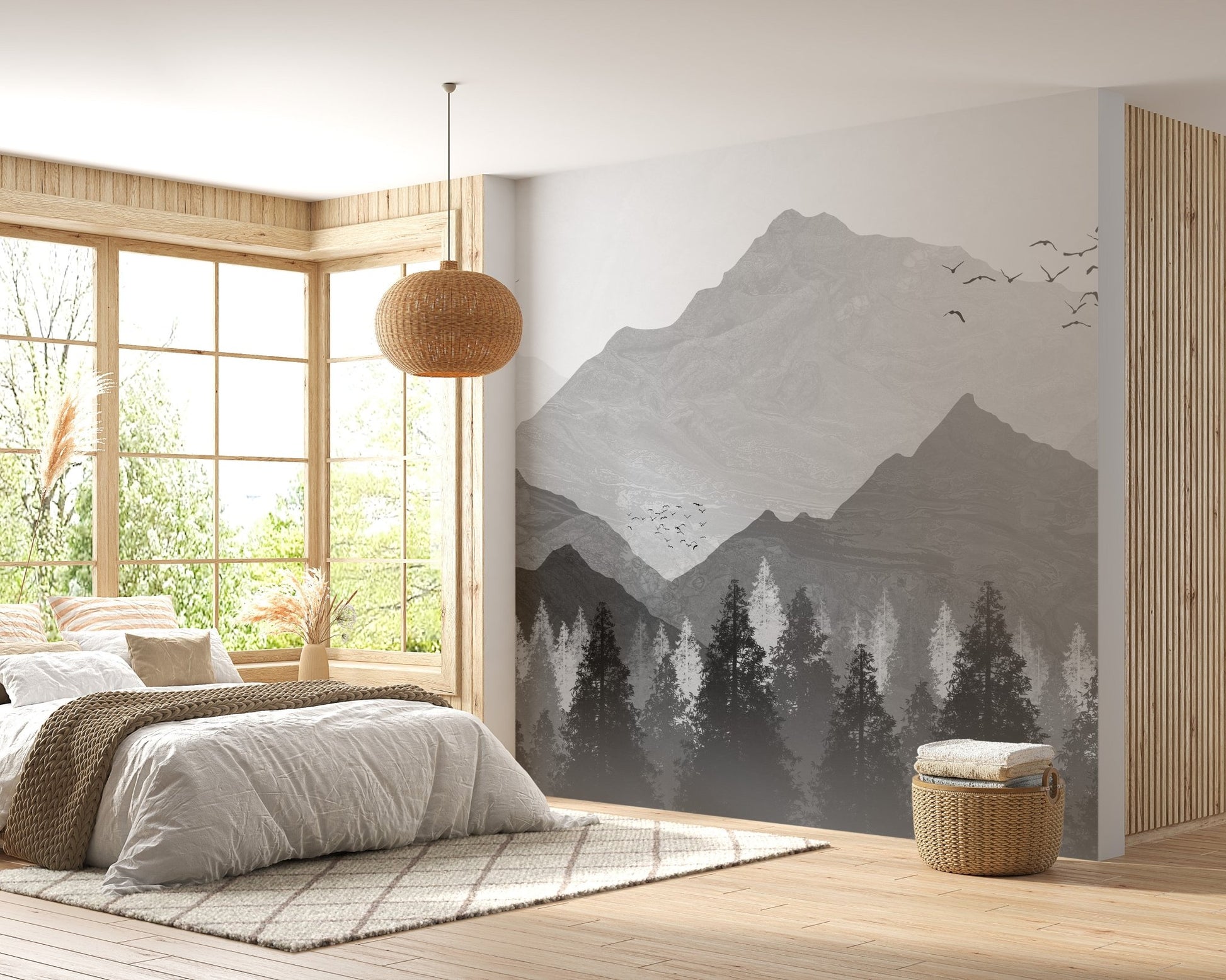 Bright bedroom with a mountain range wall mural and wooden window frames.