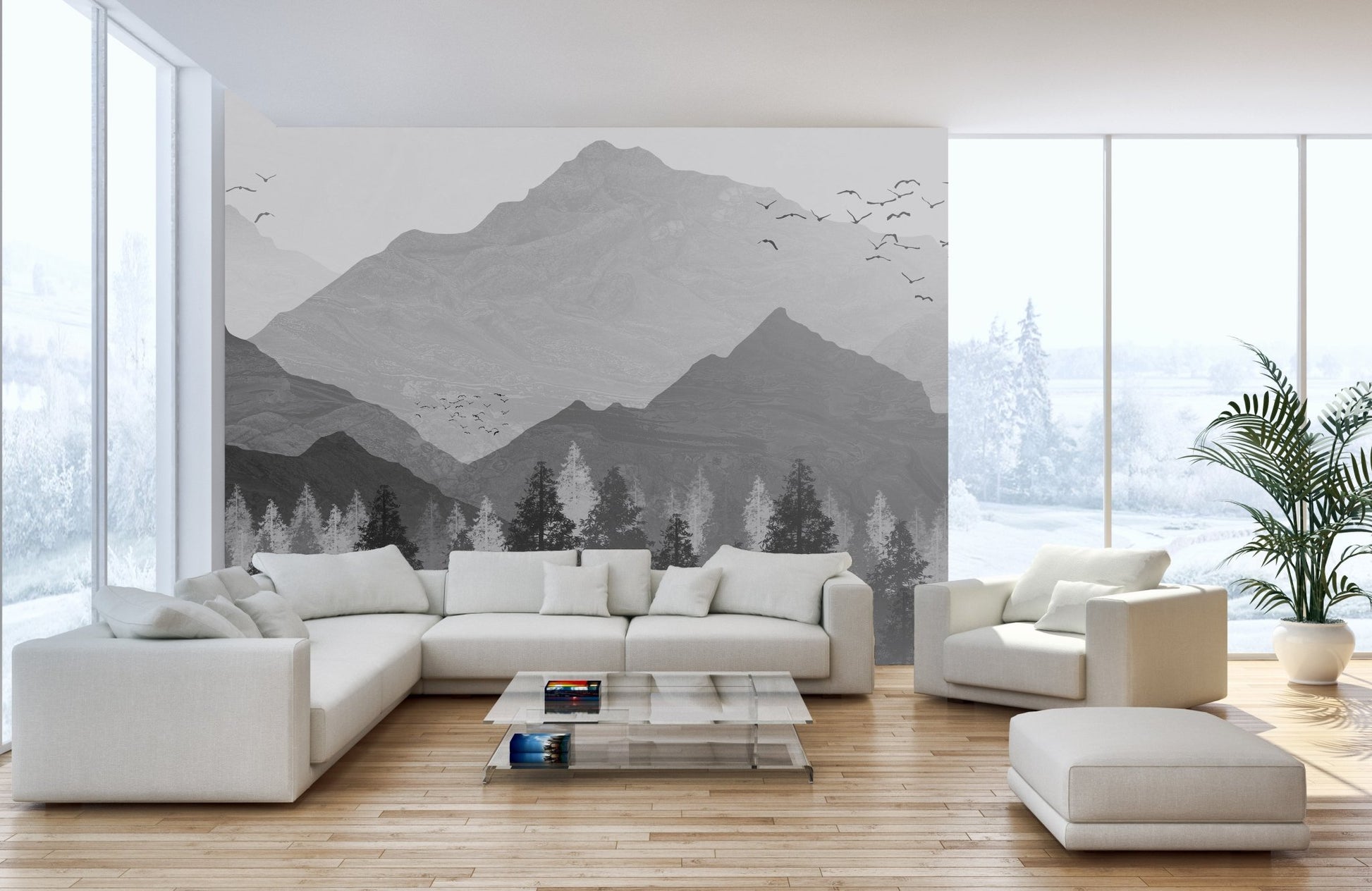 Grey and white mountain wall mural behind a comfortable sofa arrangement.
