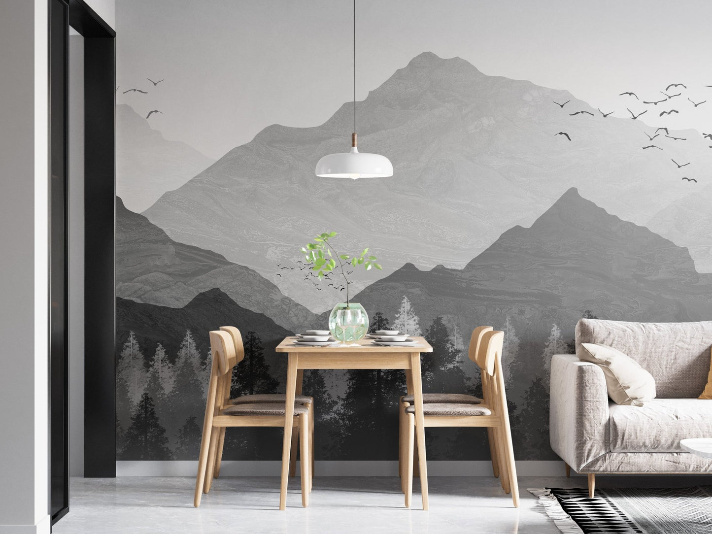 Minimalist dining area with a mountain peak wall mural and wooden furniture.
