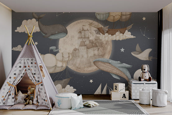 Flying dolphins and whales mural with  floating castles in modern playroom.