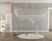 Grey whale wall mural in a playroom with a white circular rug.