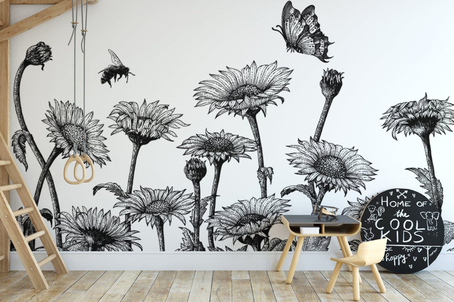 Hand-drawn sunflower wall mural in a minimalist nursery with a wooden crib.