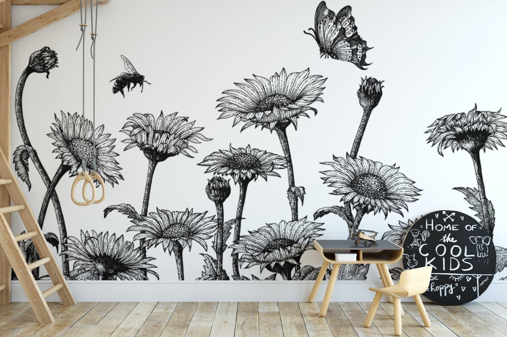 Hand-drawn sunflower wall mural in a minimalist nursery with a wooden crib.