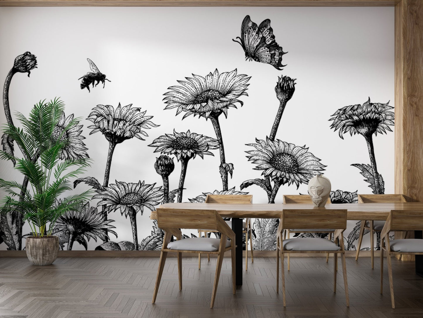Black and white floral field wall mural behind a wooden dining table and chairs.