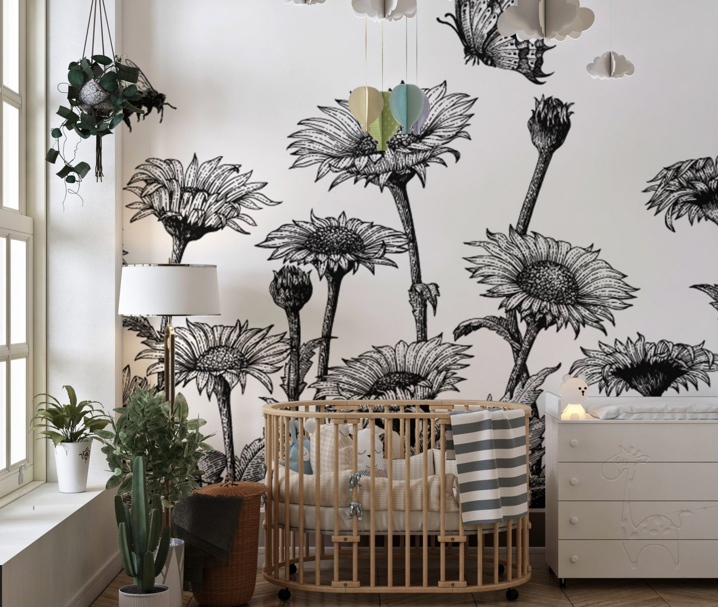 Monochrome botanical sketch wall mural in a bright bedroom with neutral bedding.