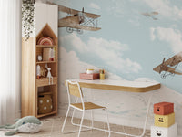Fun-filled sky mural with airplanes and dreamy clouds in study room.
