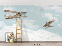 Sky adventures mural with playful clouds and balloons in kids room.
