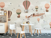 Toddler dining room with hot air balloon safari wall mural and small table.